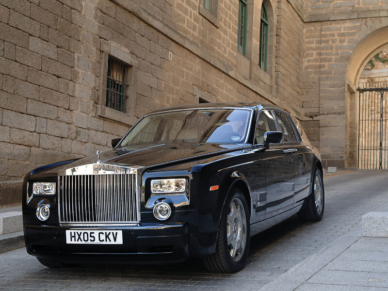 Black Rolls-Royce parked on street