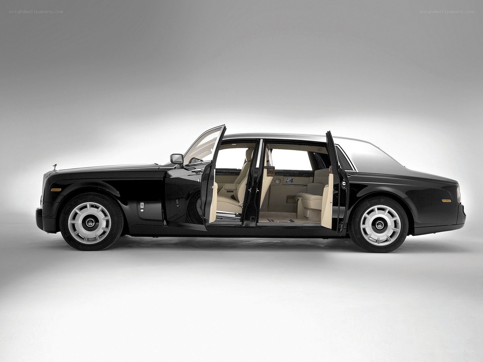 Black Rolls-Royce with open doors