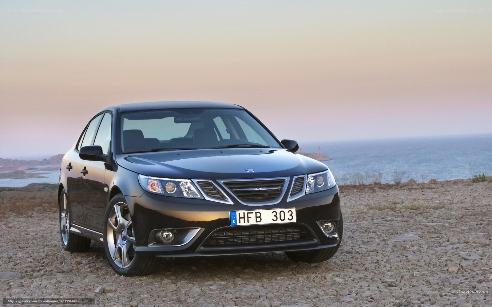 Black Saab 9-3 by the sea