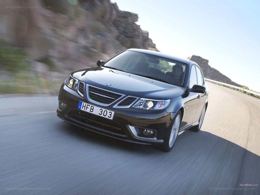 black saab driving on mountain road