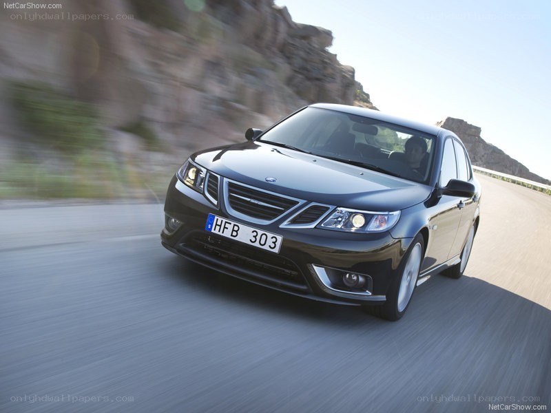 black saab driving on road