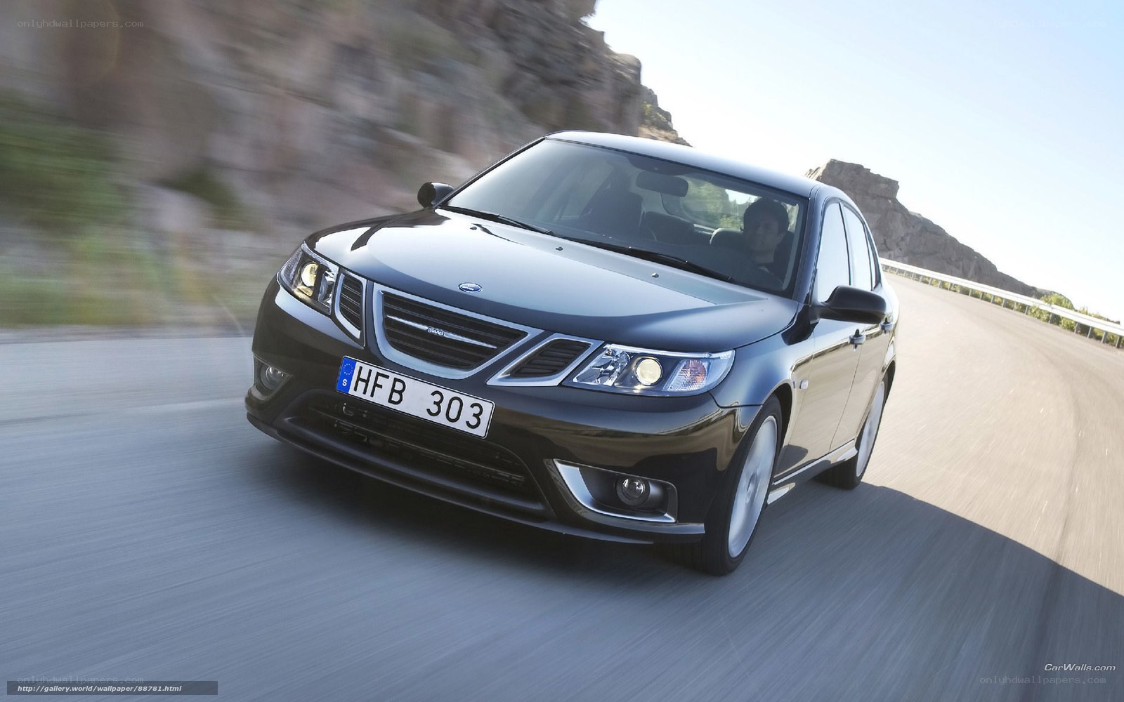 black saab driving on road