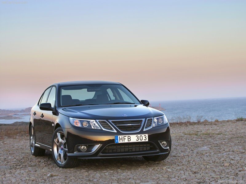 Black Saab sedan on a coastal cliff