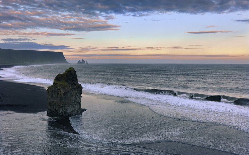 Black sand beach at sunset