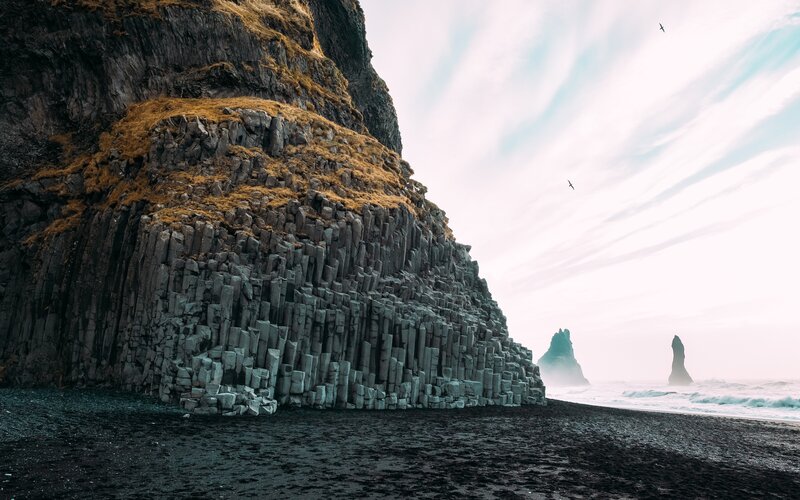 Black Sand Beach with Basalt Columns — Dramatic