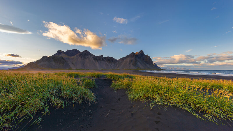 Black Sand Beach with Mountains — Blue