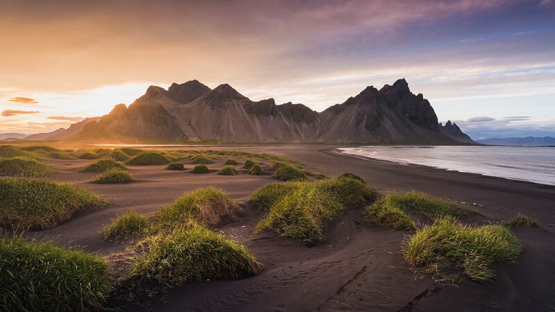 Black Sand Beach with Mountains — Brown