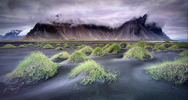 Black Sand Beach with Mountains — Dramatic, Photograph, Clouds
