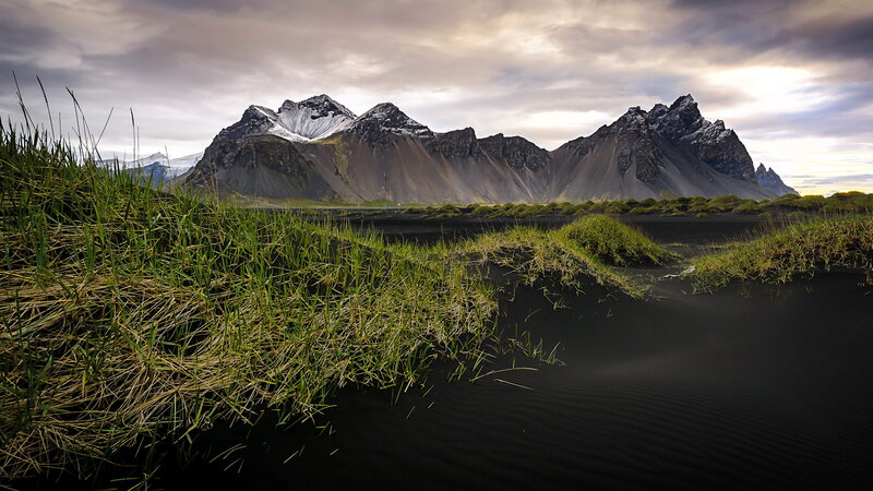 Black Sand Beach with Mountains — Dramatic, Sunset, Photograph, Grass, Sky