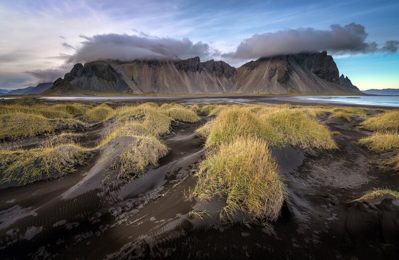 Black Sand Beach with Mountains — Dramatic, Sunset, Photograph, Grass