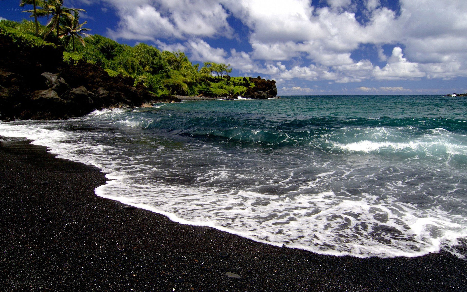 black sand beach with ocean waves