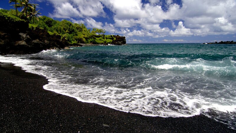 black sand beach with ocean waves