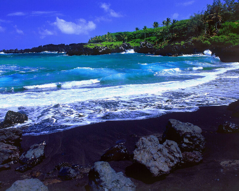 black sand beach with turquoise waves