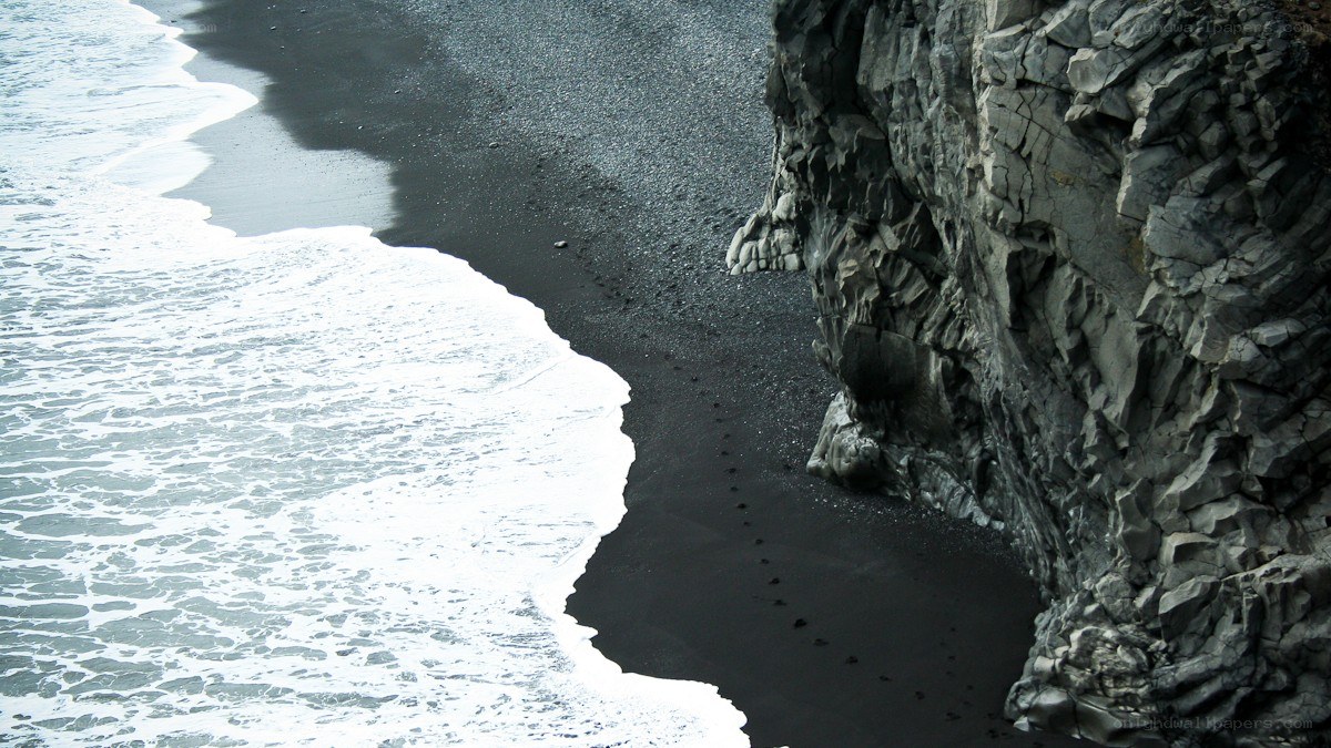 Black sand beach with waves
