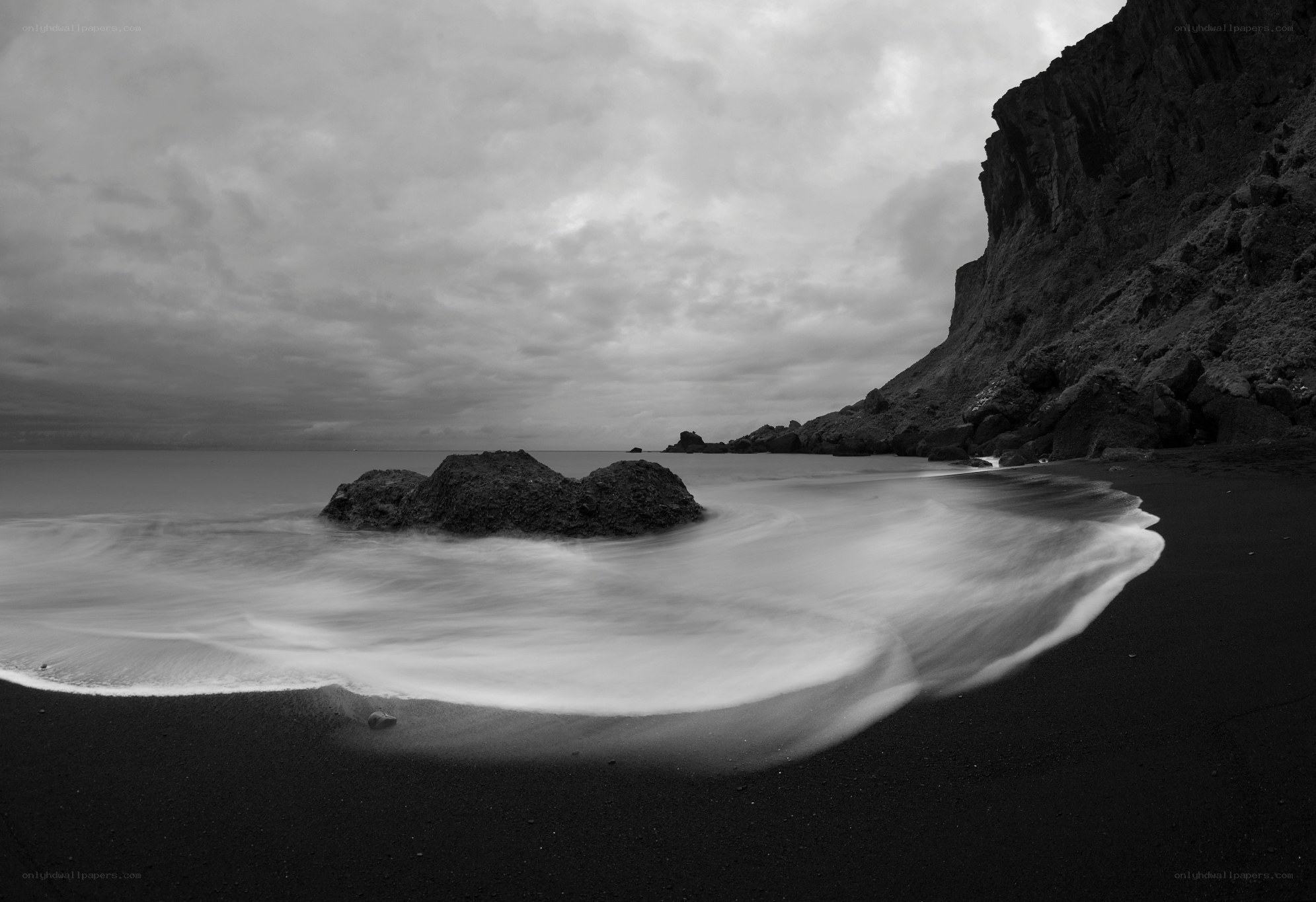 Black sand beach with waves
