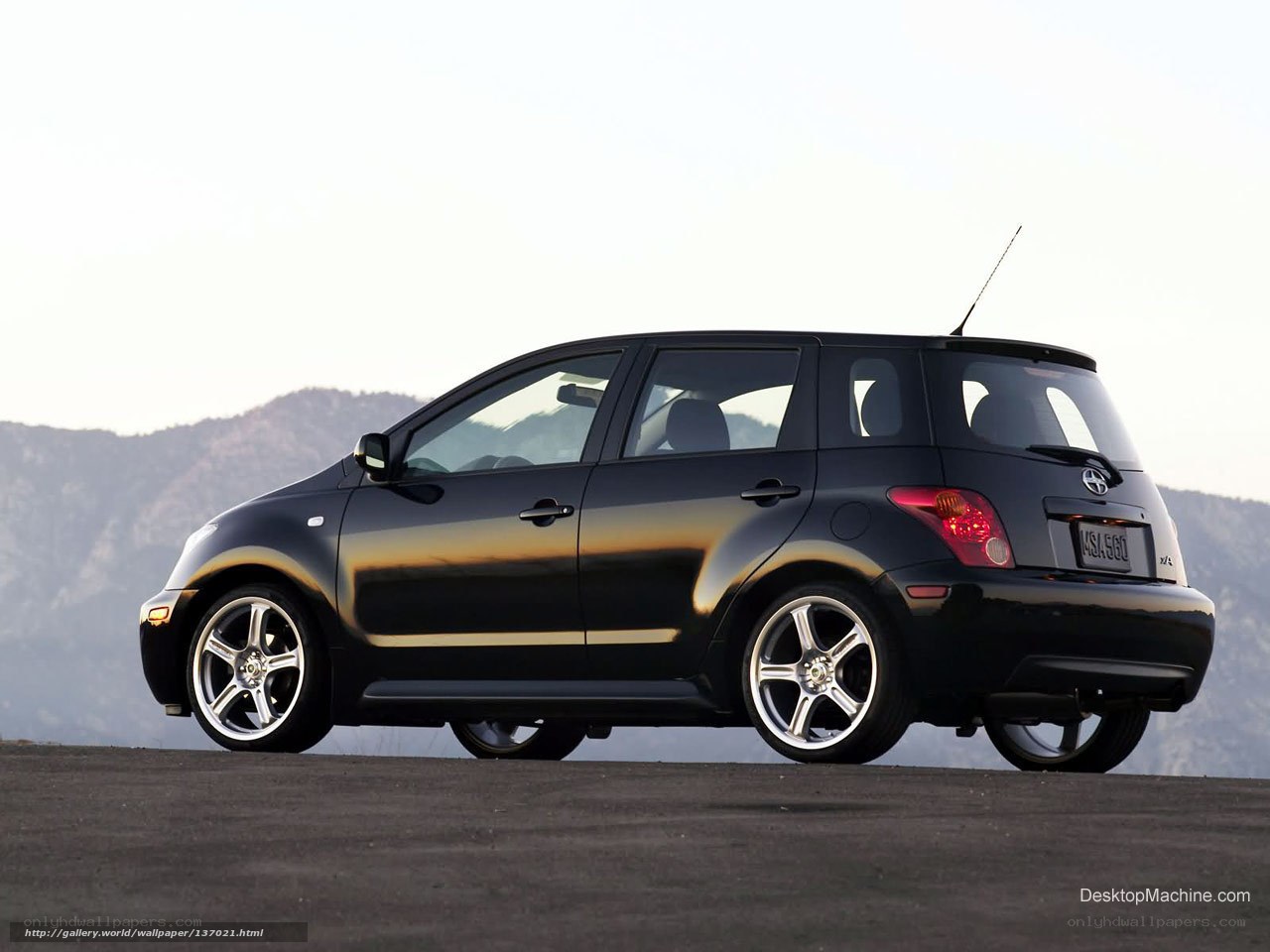 Black Scion xA on a mountain road