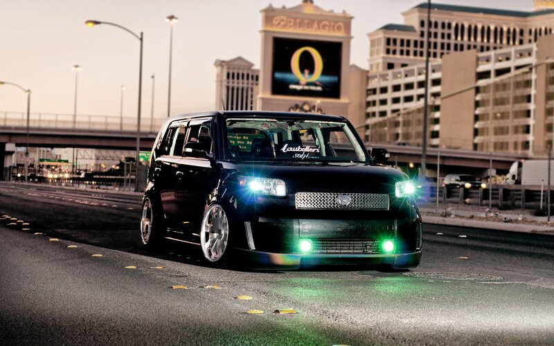 Black Scion xB on city street