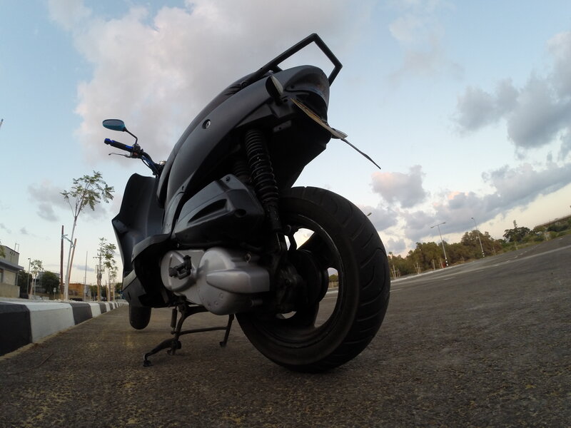 Black Scooter on Pavement
