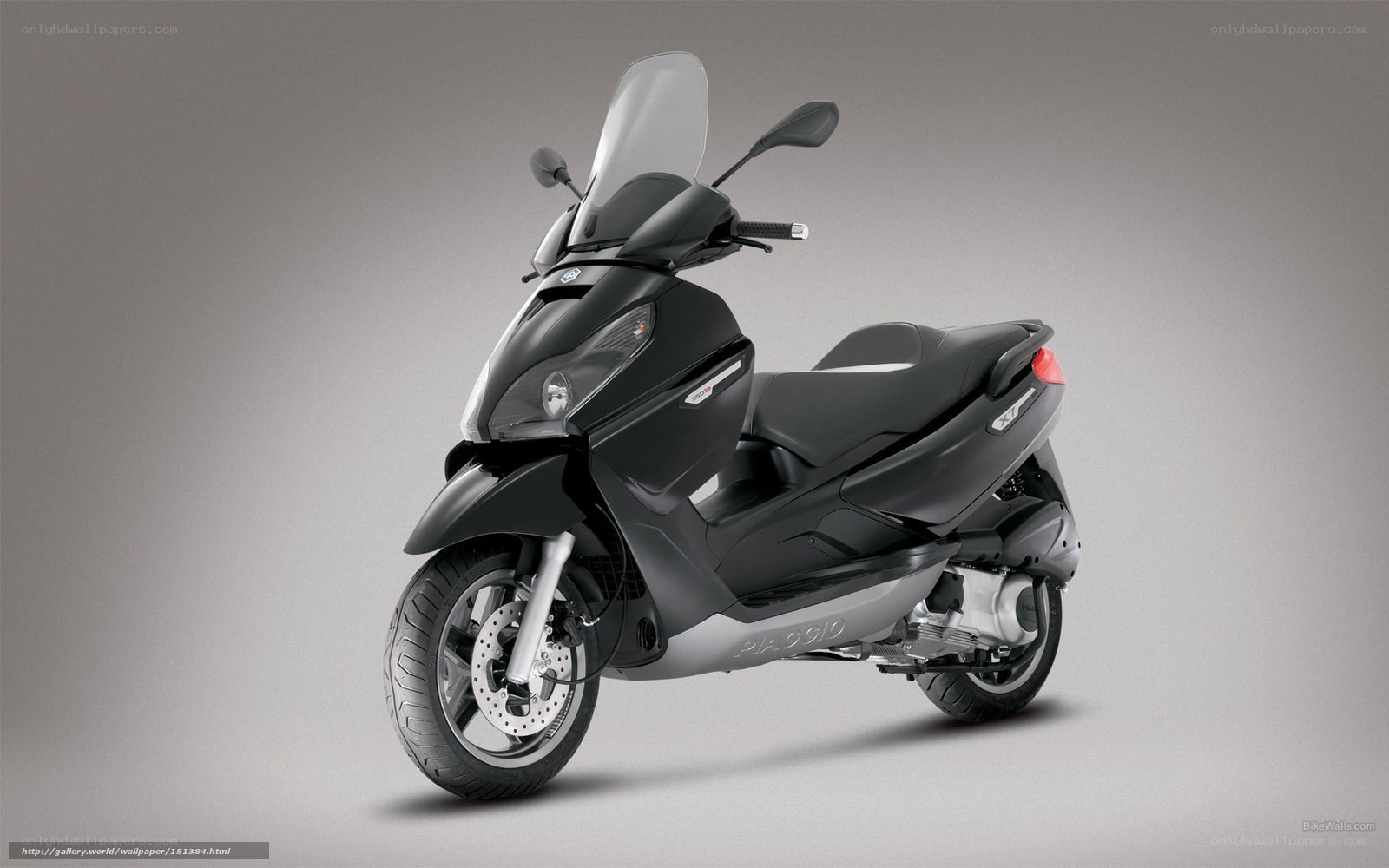 black scooter with windscreen