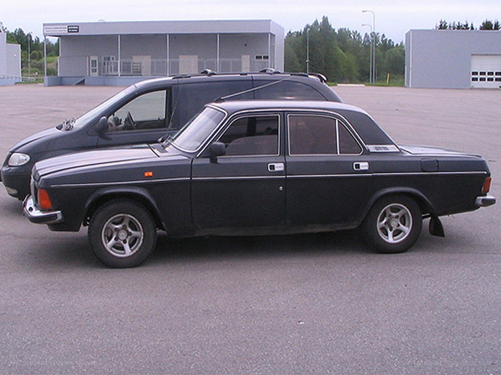 black sedan and minivan parked