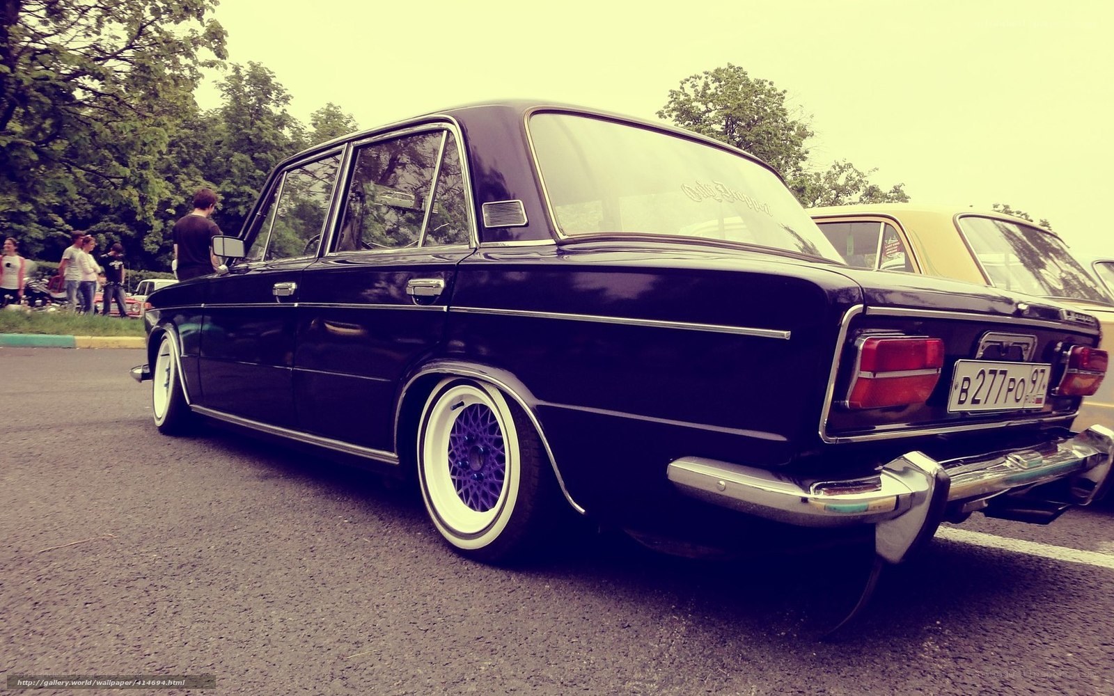 Black sedan at car show