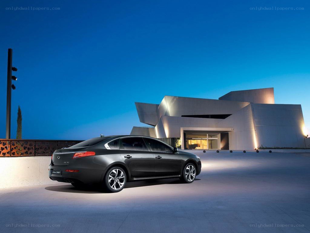 Black sedan at modern building