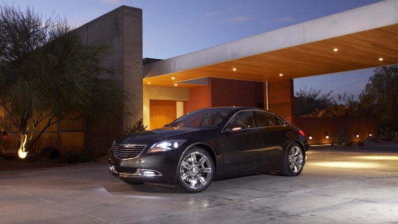 Black sedan at modern house