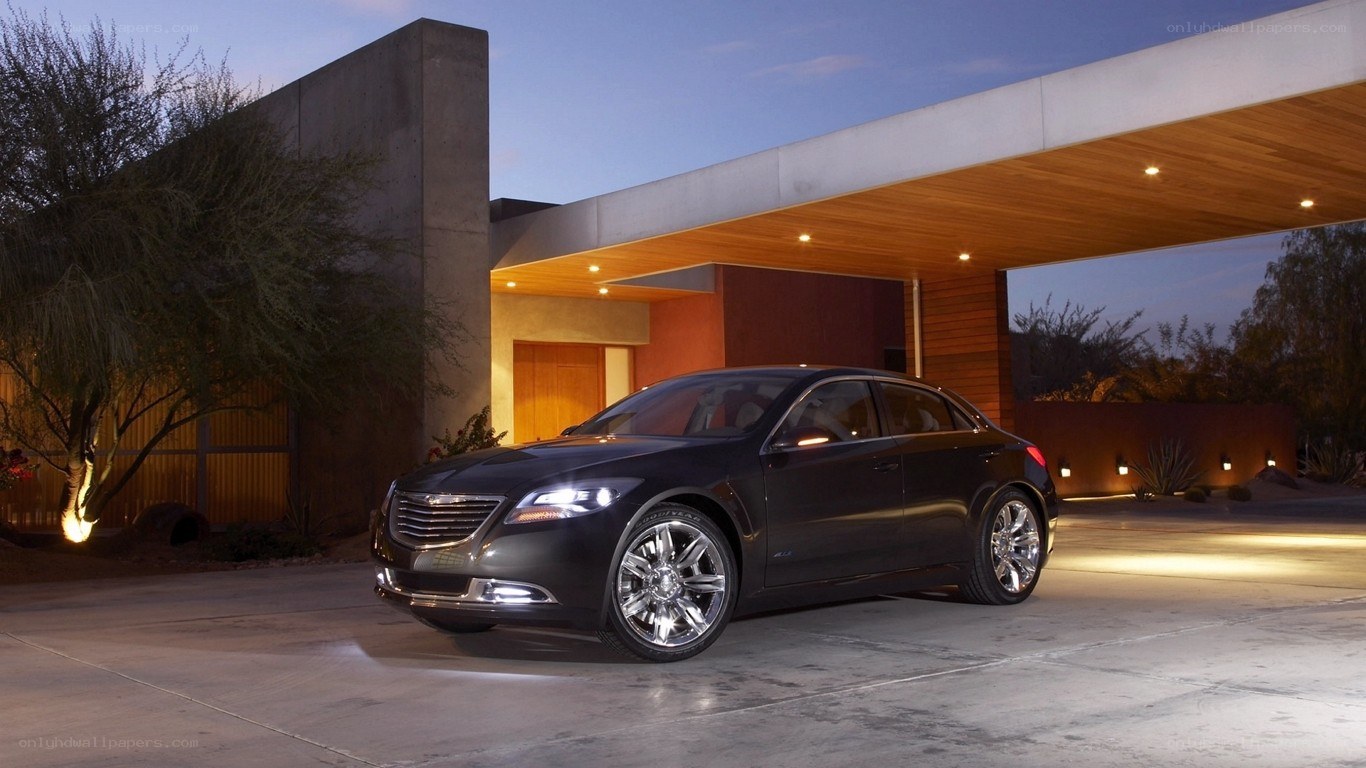 Black sedan at modern house