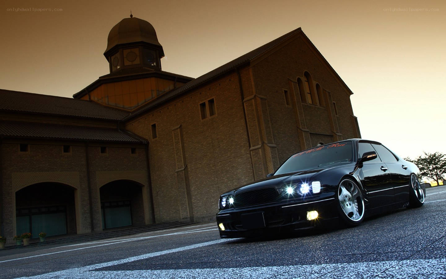 black sedan at sunset