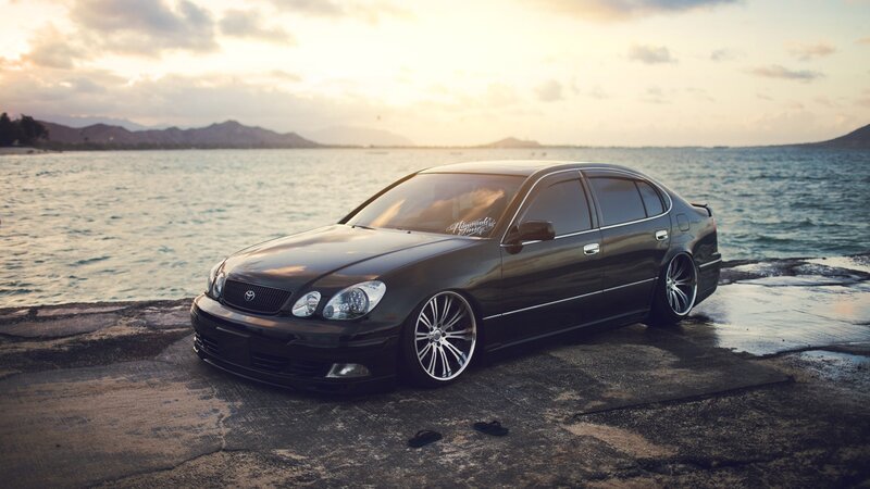 Black Sedan Car — Serene, Sunset, Photograph, Sea, Mountains