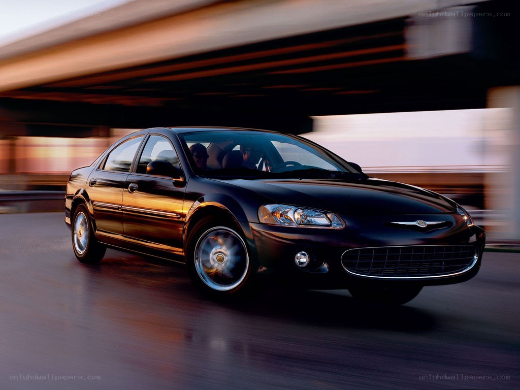 Black sedan driving on highway
