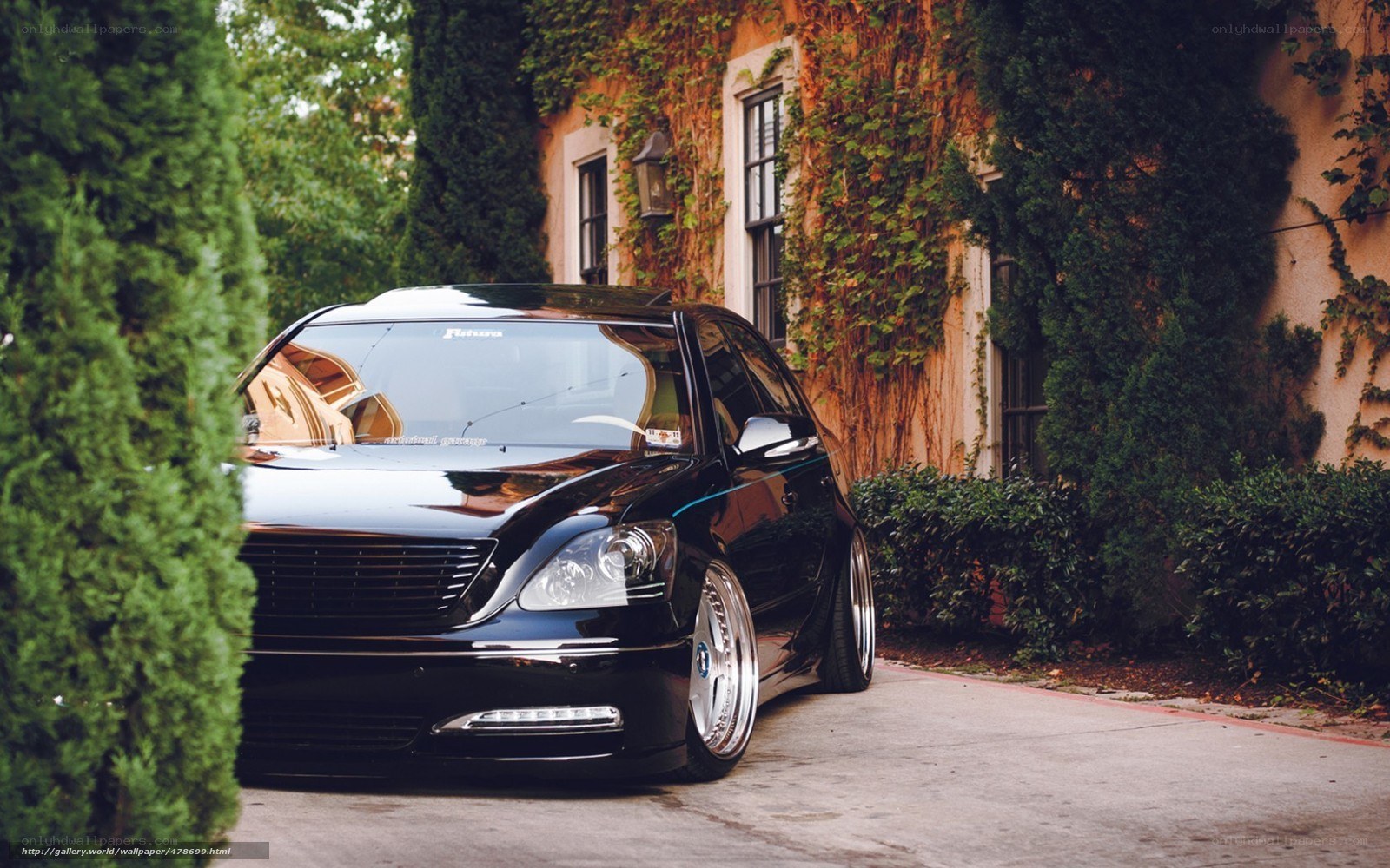 Black sedan in a driveway