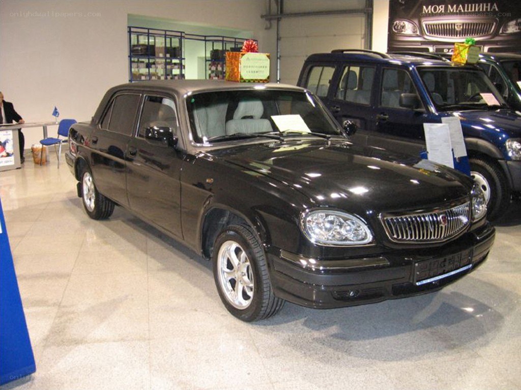 Black sedan in car showroom
