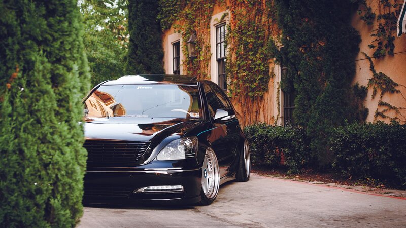 black sedan in driveway
