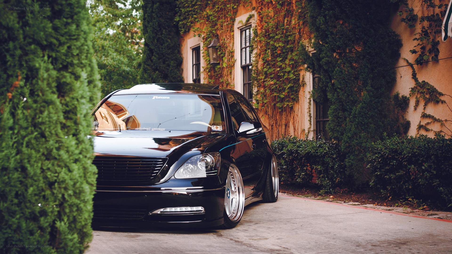 black sedan in driveway