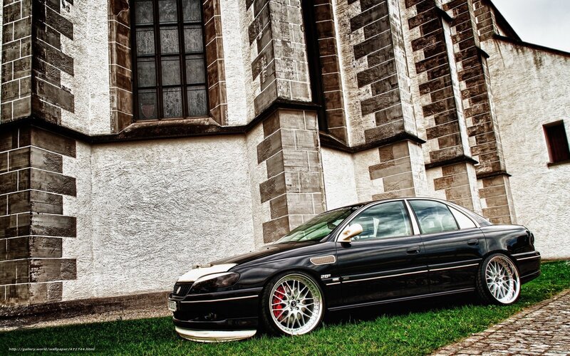 Black sedan in front of church