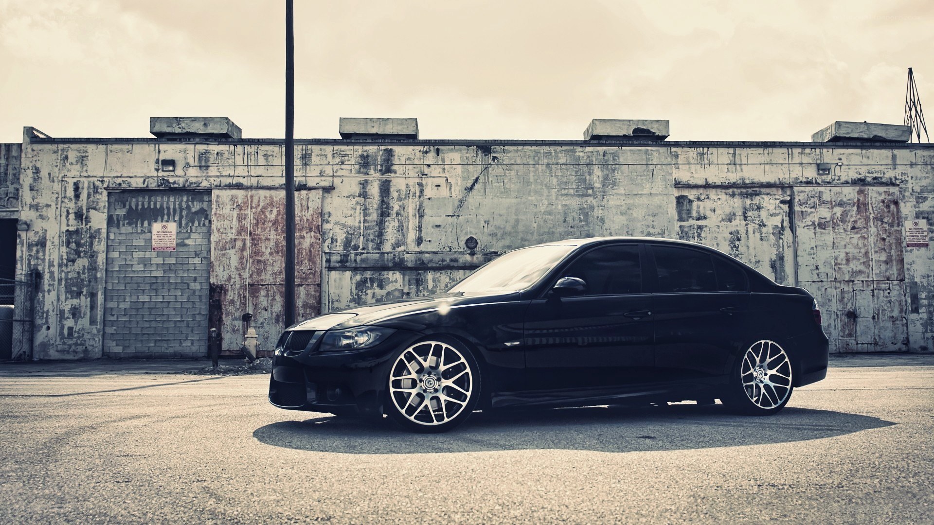 black sedan in industrial area