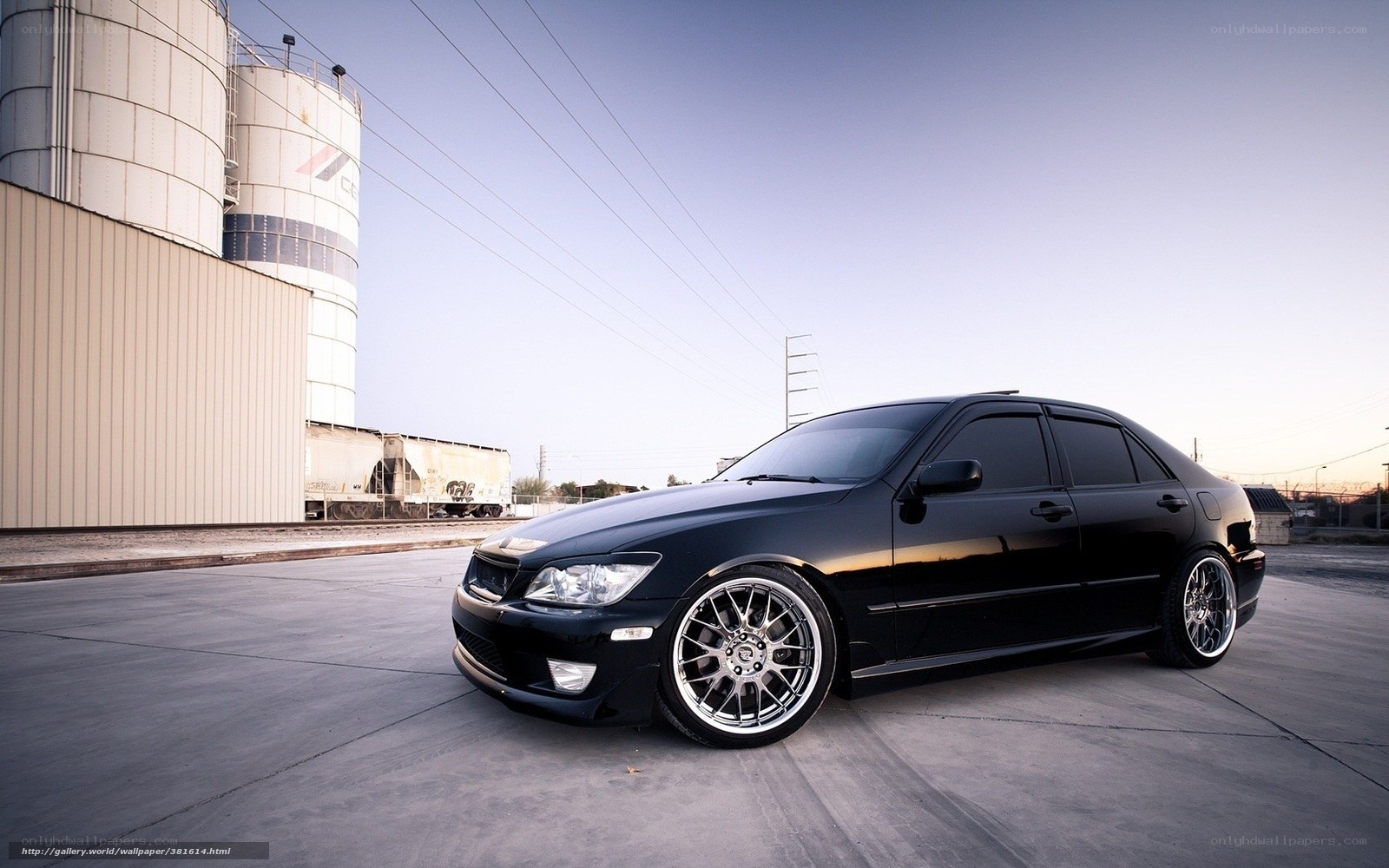 Black sedan in industrial area