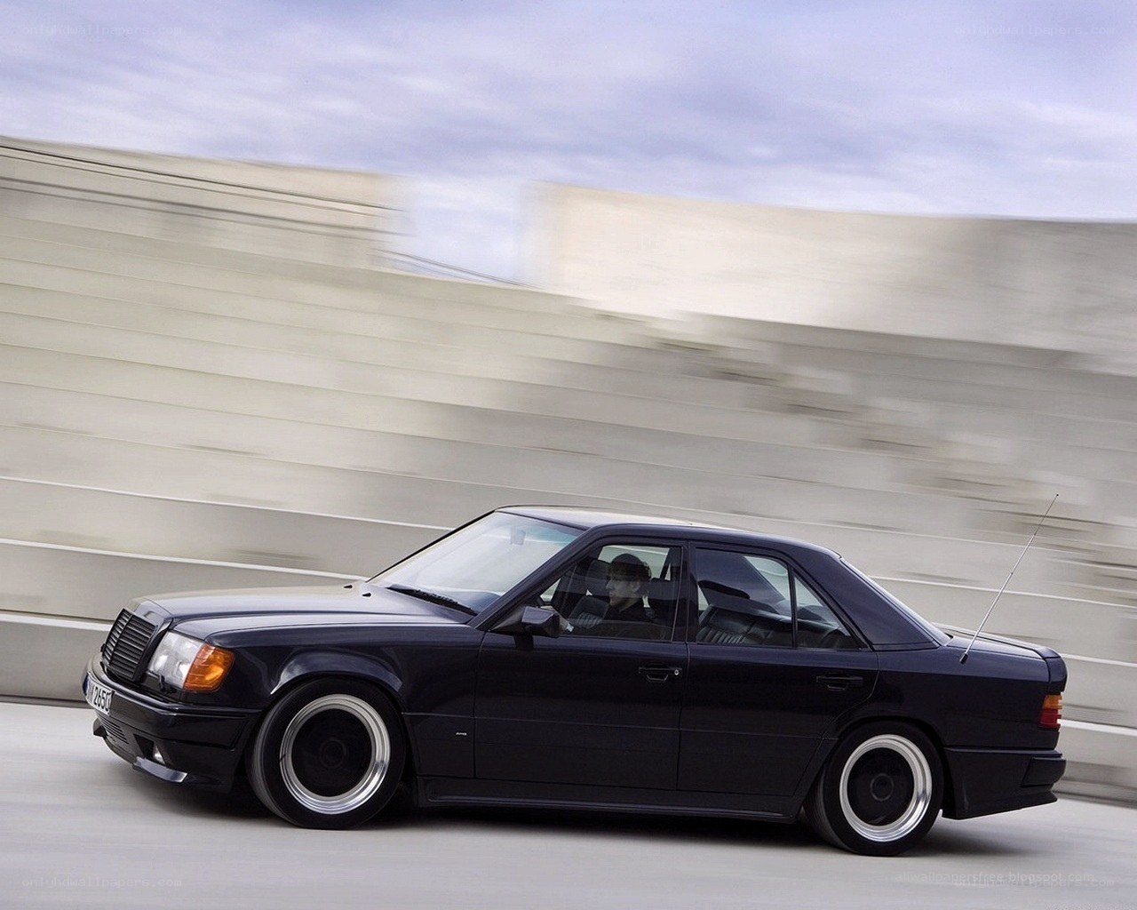 black sedan in motion