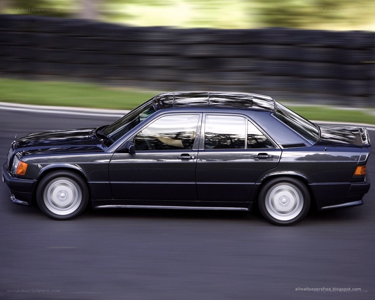 black sedan in motion