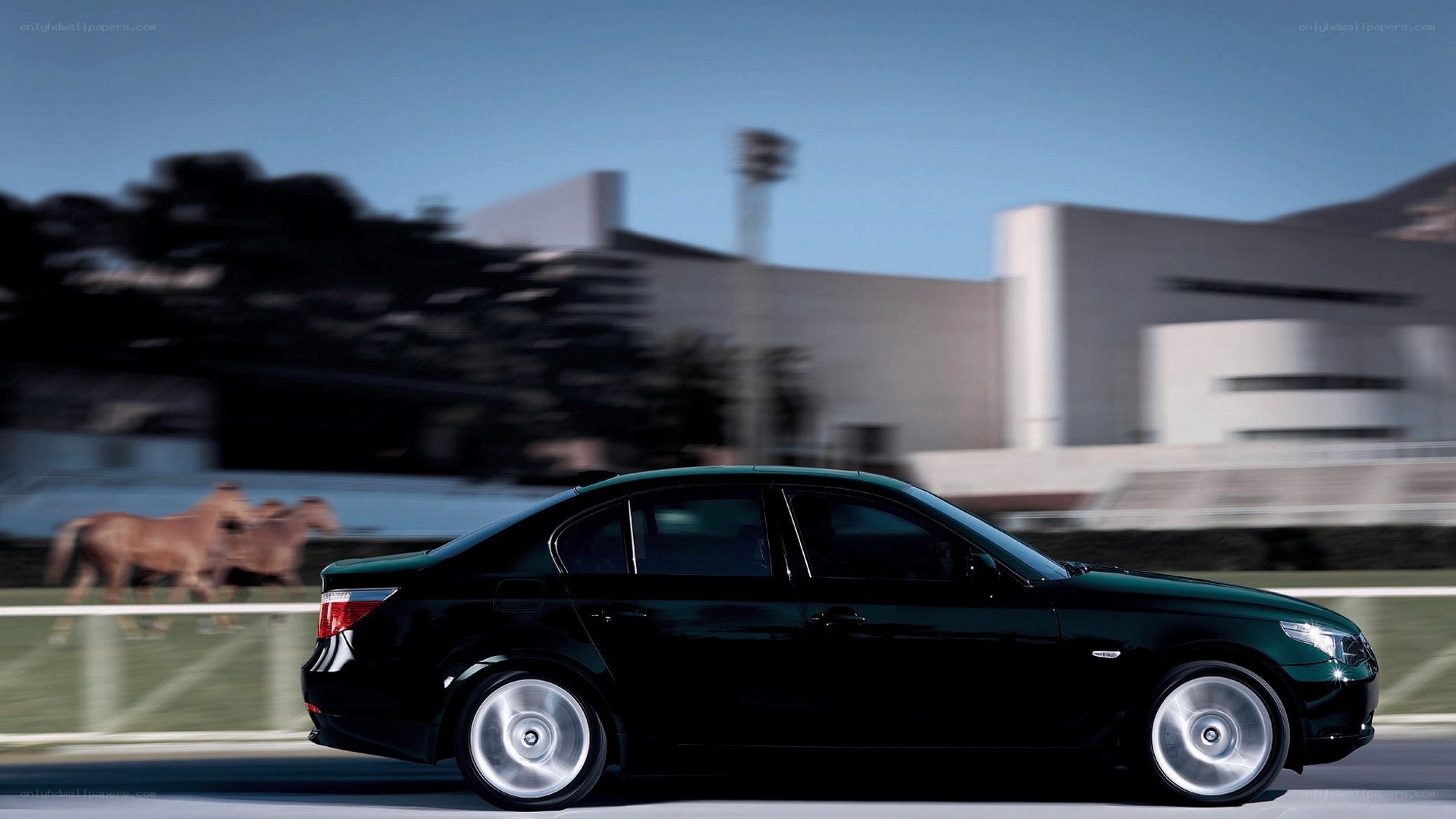 black sedan in motion