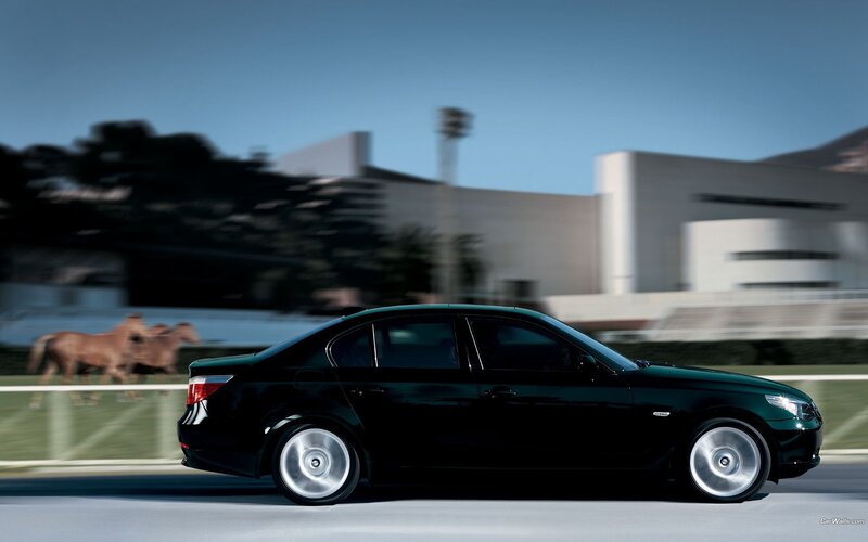 black sedan in motion