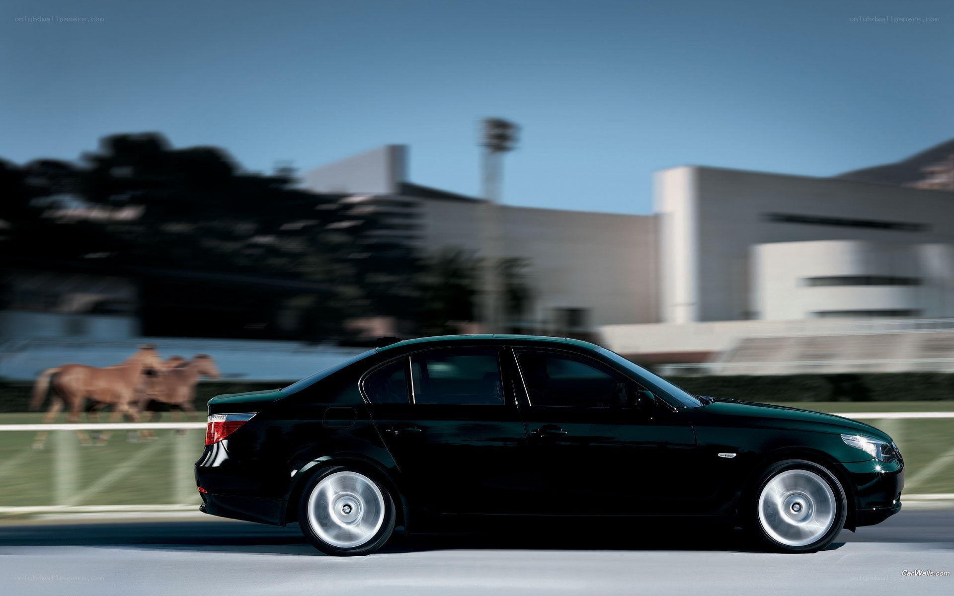 black sedan in motion