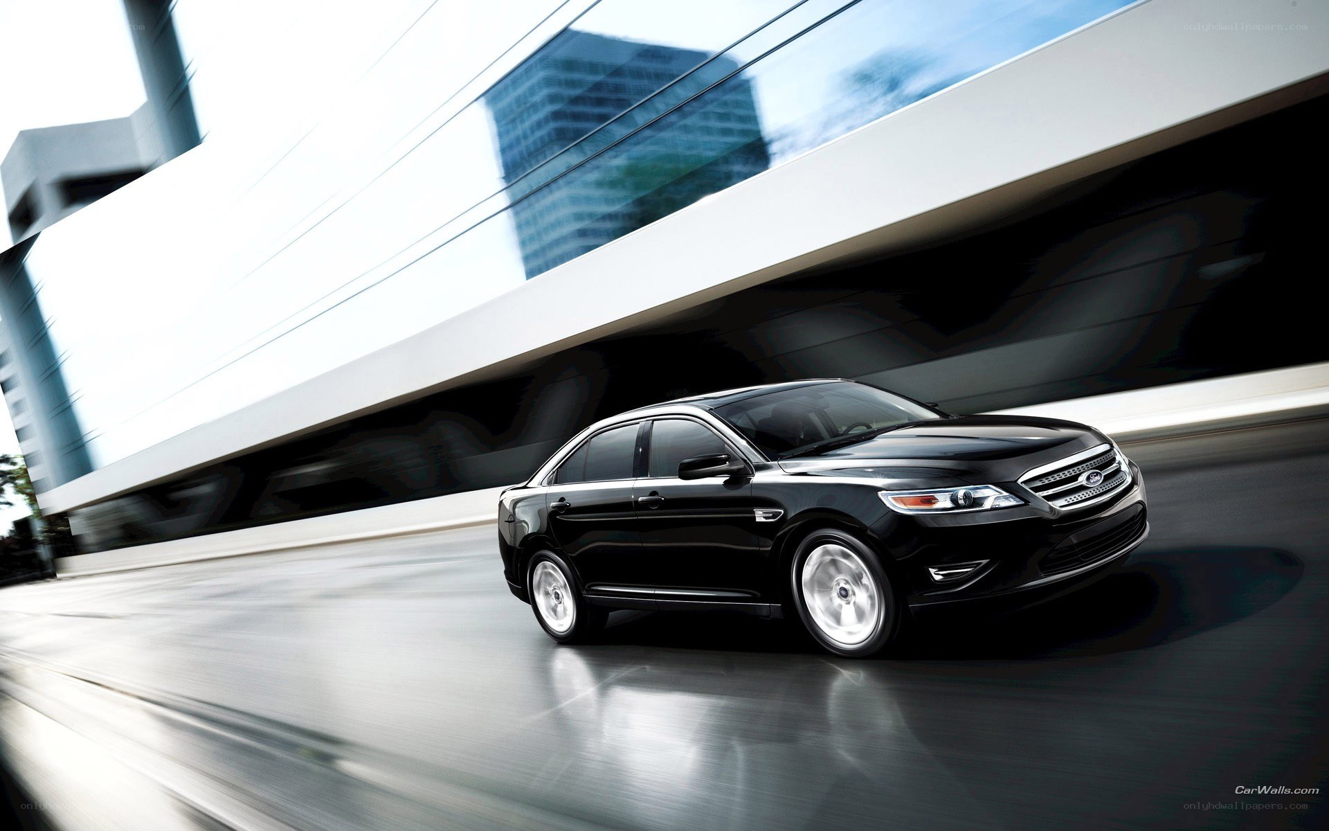 Black sedan in motion