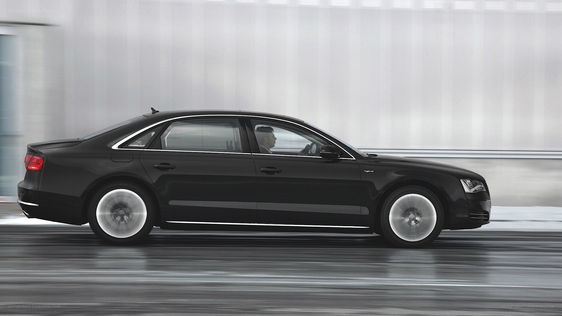 black sedan in motion