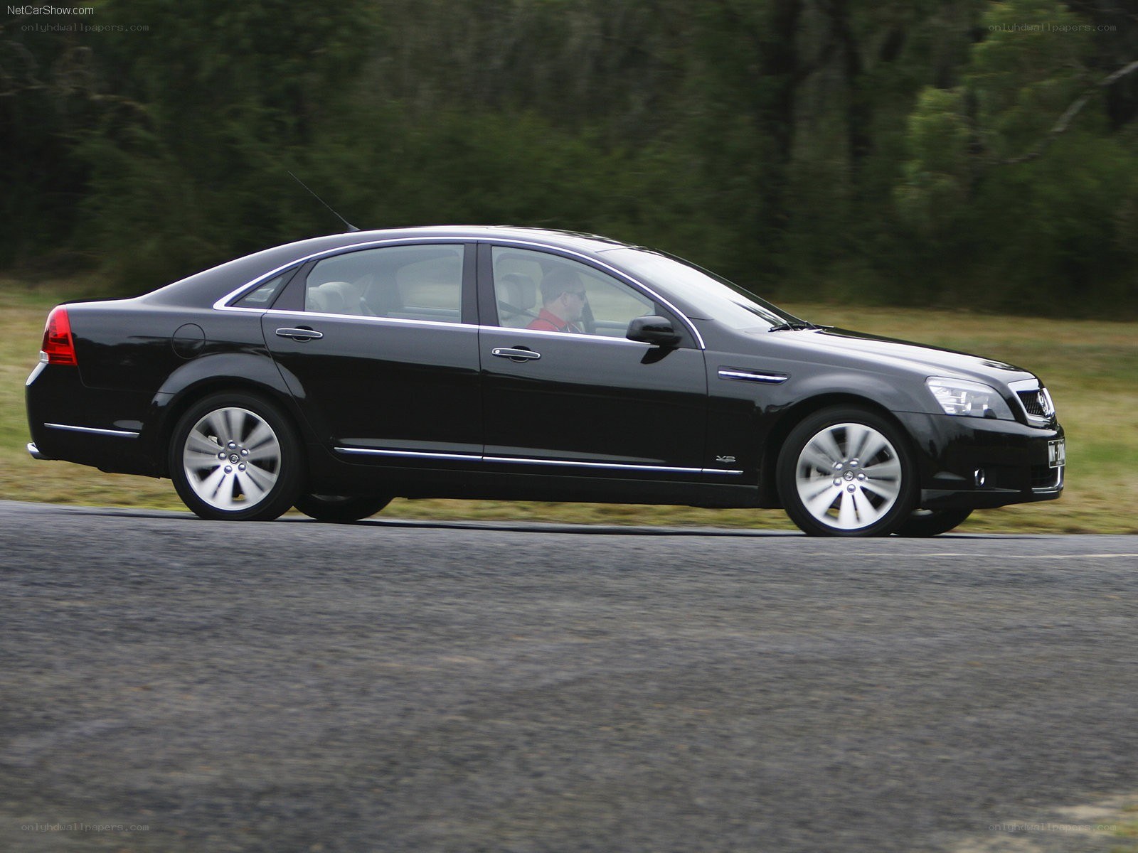 black sedan in motion