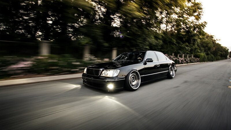 black sedan in motion