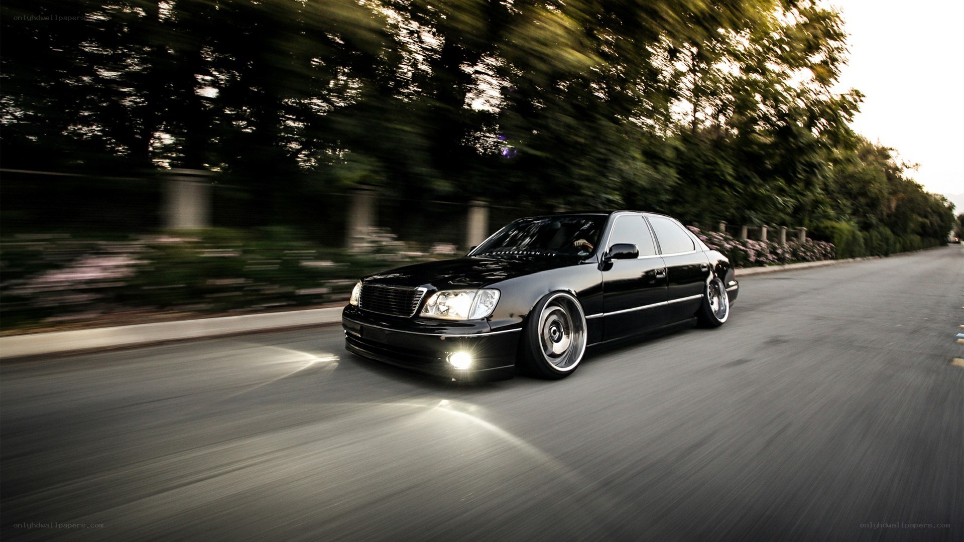 black sedan in motion