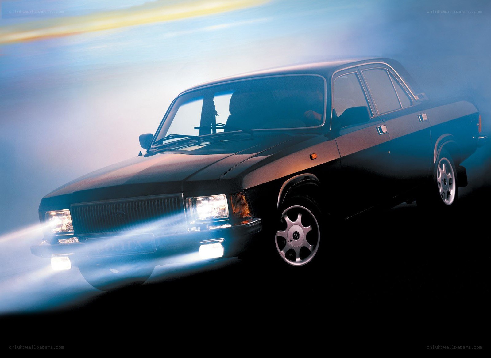 Black sedan in motion