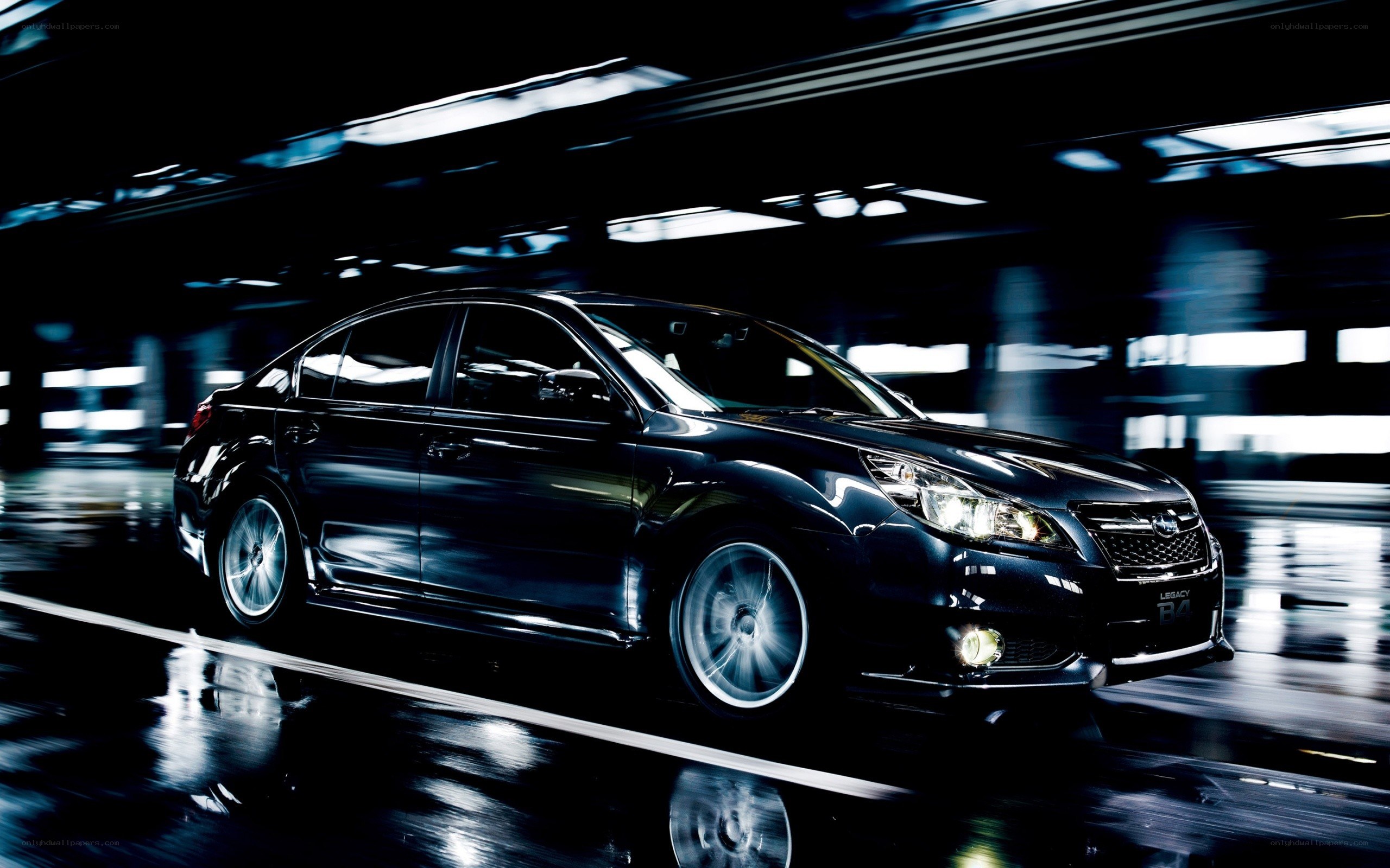Black sedan in motion